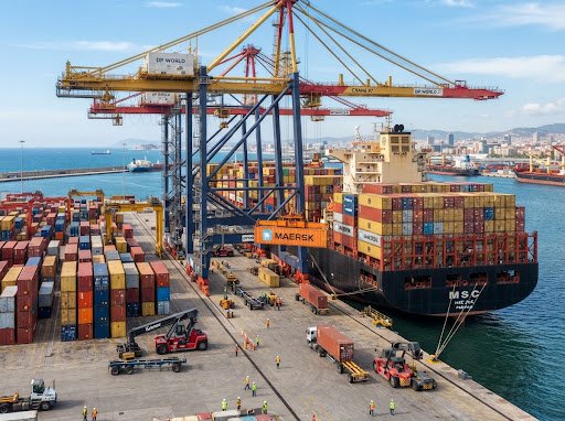 Commercial cargo container shipping port terminal with gantry cranes loading container vessel